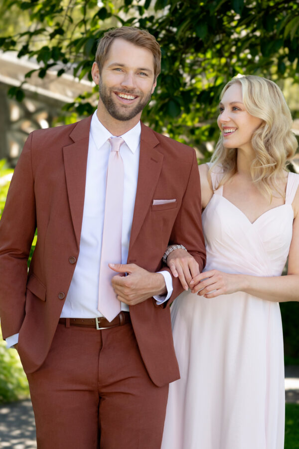 Metro rust color suit shown jacket and pants and a pink long tie