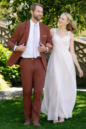 Metro rust color suit shown jacket and pants and a pink long tie
